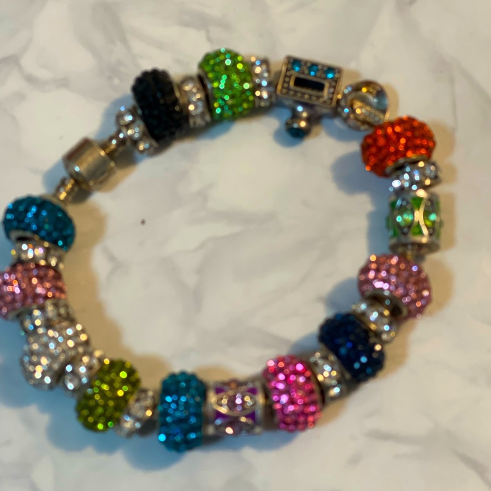 Bracelet w/sterling silver & crystal stones in the charms.
